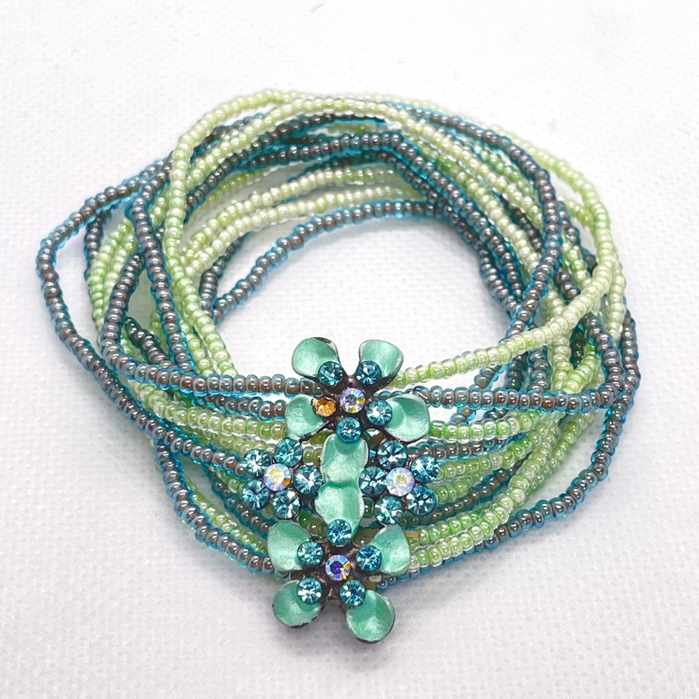 Layered / Layering bracelet in green and blue. Metal & rhinestone floral detail